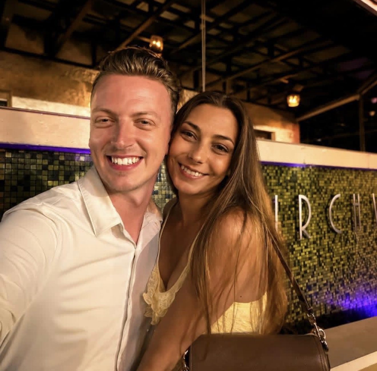 Tyler, owner and founder of Harn Detailing Co., smiling with Tyler's girlfriend