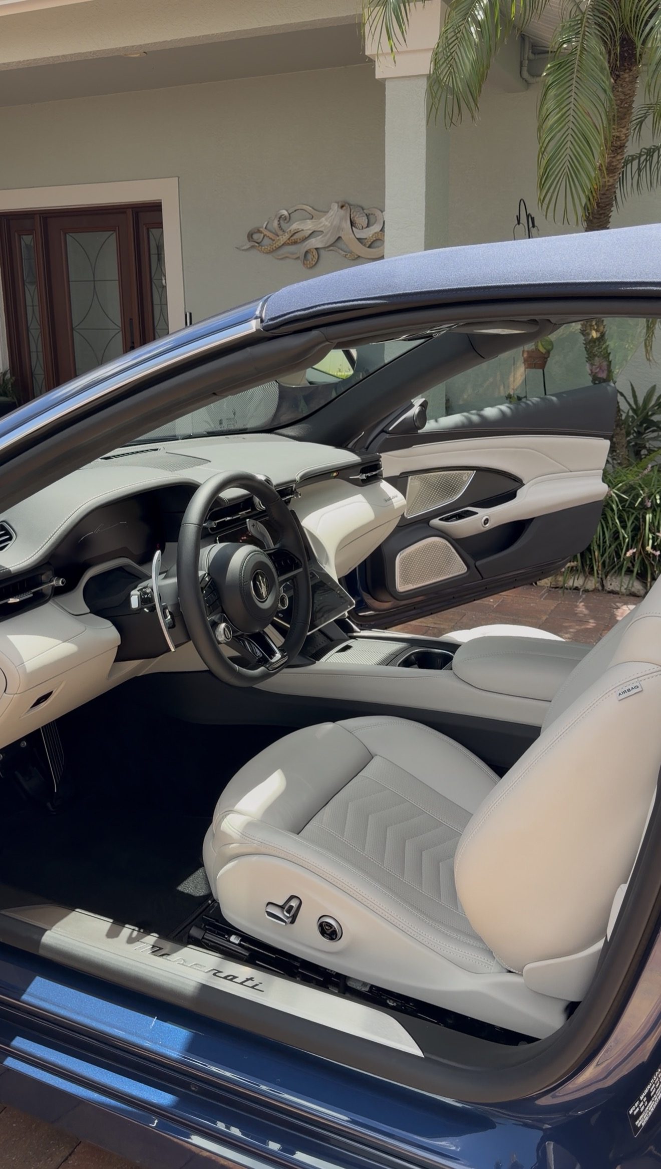 Detailed white leather interior of a Maserati GranCabrio